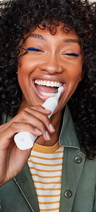 Burst photo of woman brushing teeth