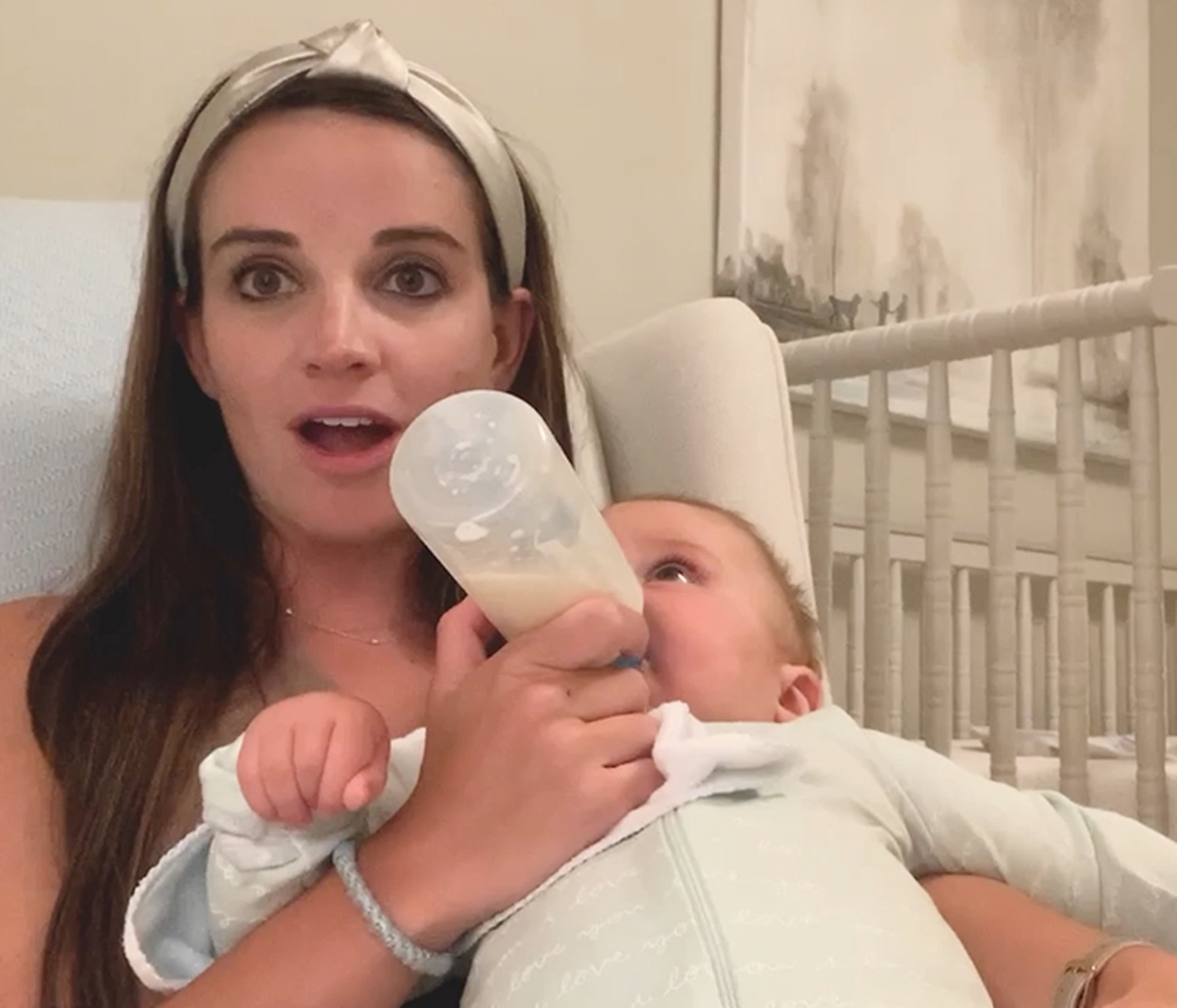 Mother feeding a baby with a bottle