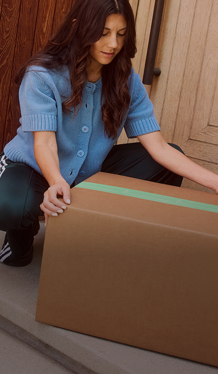 Mom picking up delivery box