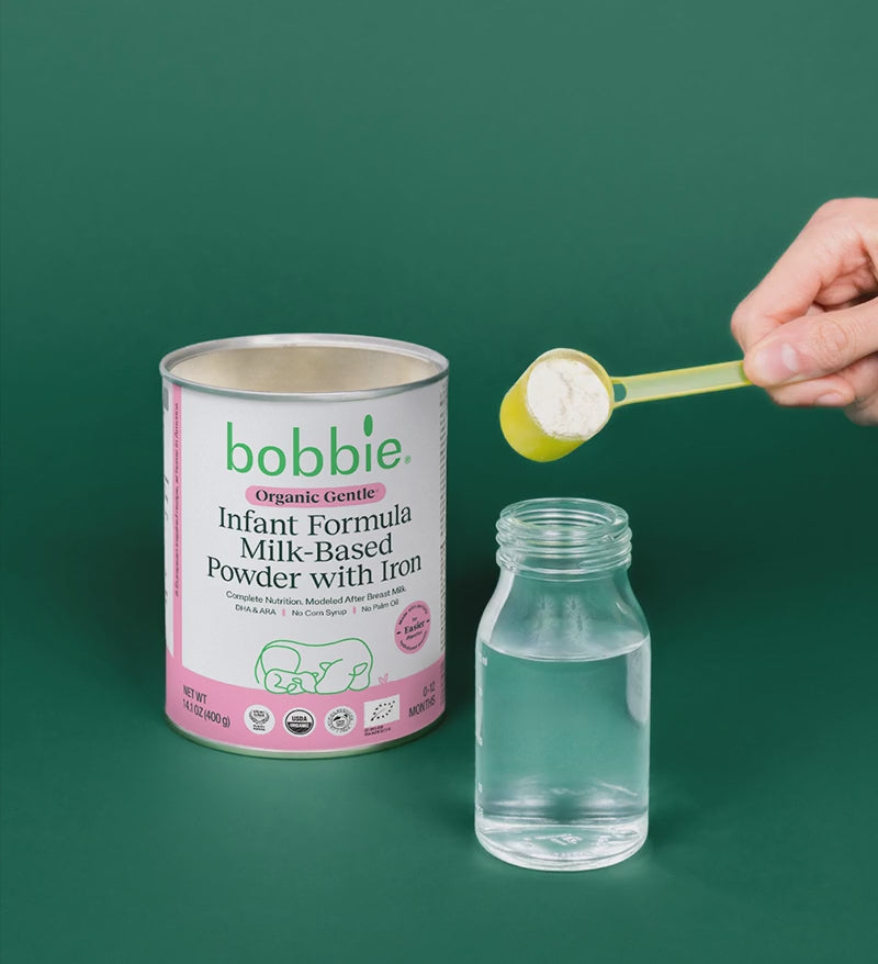 Gif of formula being scooped out of the Organic Gentle can and into a bottle